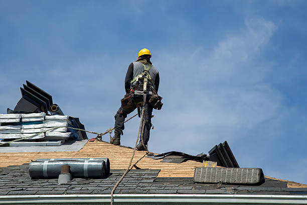 Professional Roof Replacement technician working in Orient, NY